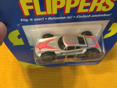Indigo military car / Silver sports car