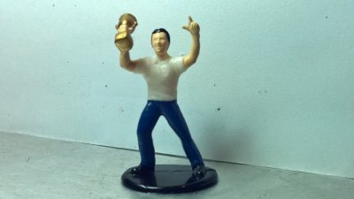 Action Figure - Man In White Shirt Holding Trophy
