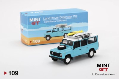 Land Rover Defender 110 Light Blue w/ Surfboard
